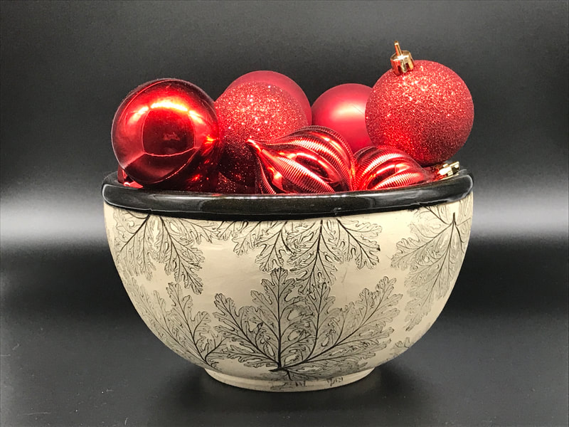 Artist: Valerie Hawkins.
Functional pottery in black and white with detailed botanical motifs
